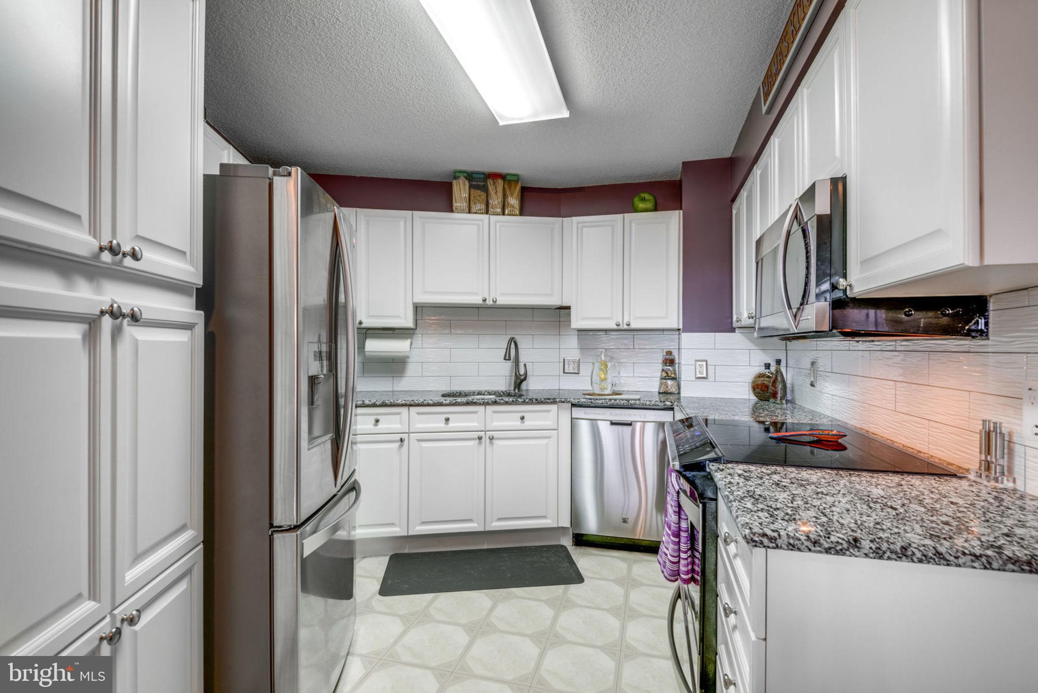 19385 Cypress Ridge Terrace, Unit 721 Leesburg, VA 20176 - Photo 10 of 26 Tons of cabinet space for storage