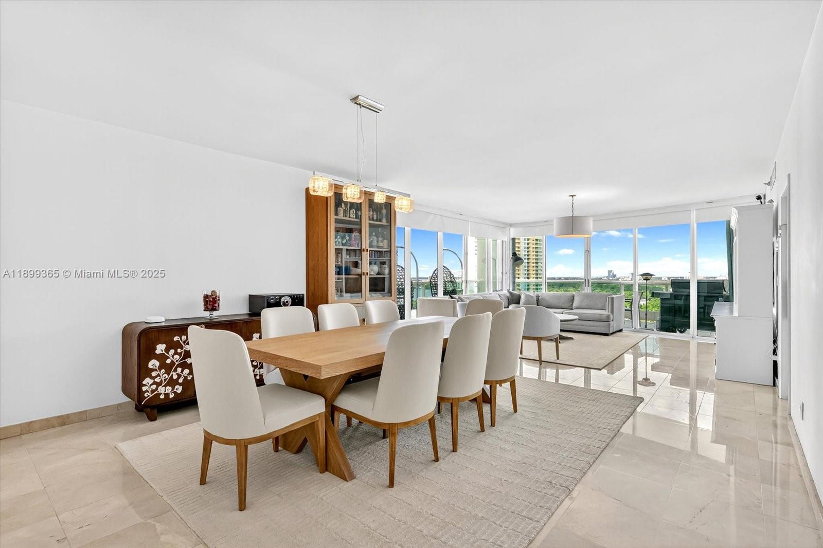 2127 Brickell Avenue, Unit 2005 Miami, FL 33129 - Photo 11 of 53 a view of a dining room with furniture window and outside view