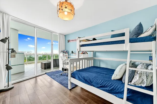 a bedroom with furniture and a window