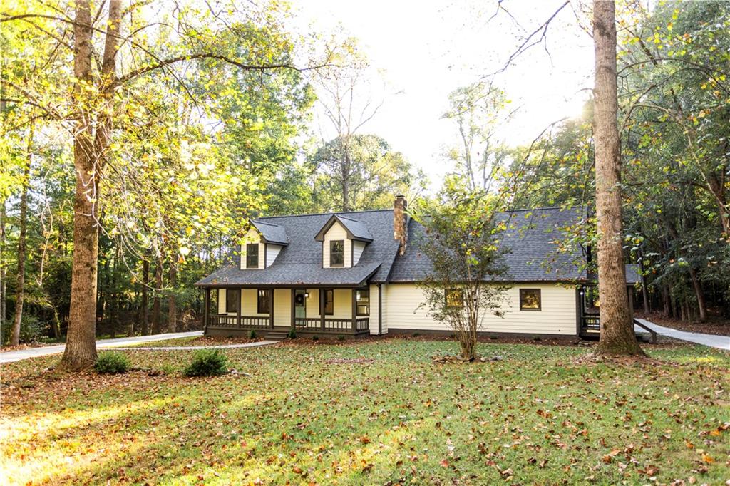 1149 Criswell Road Southeast Monroe, GA 30655 - Photo 2 of 60 a front view of a house with a yard