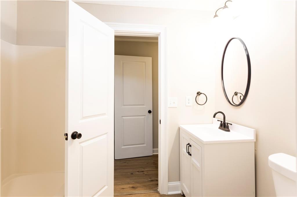 1149 Criswell Road Southeast Monroe, GA 30655 - Photo 23 of 60 a bathroom with a sink and a mirror