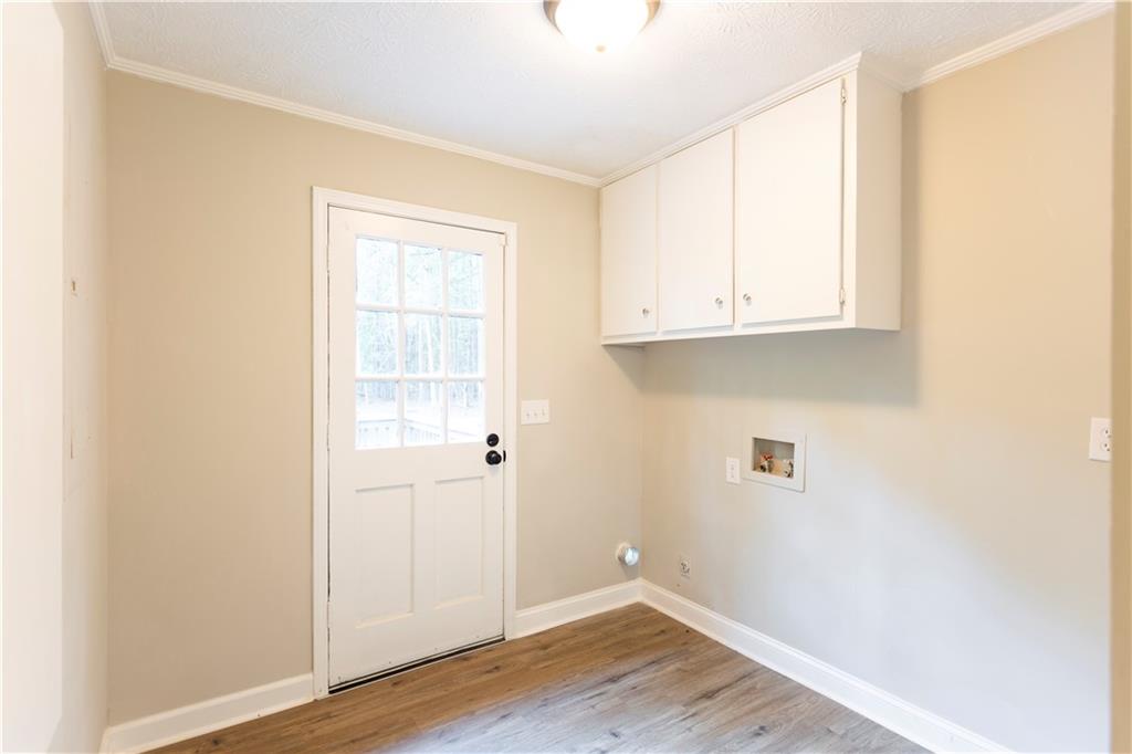 1149 Criswell Road Southeast Monroe, GA 30655 - Photo 24 of 60 a view of an empty room with wooden floor