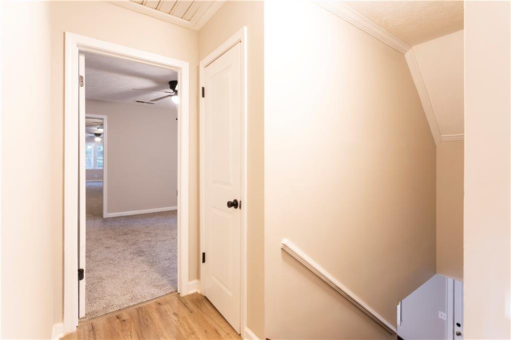 1149 Criswell Road Southeast Monroe, GA 30655 - Photo 30 of 60 a view of a hallway with wooden floor