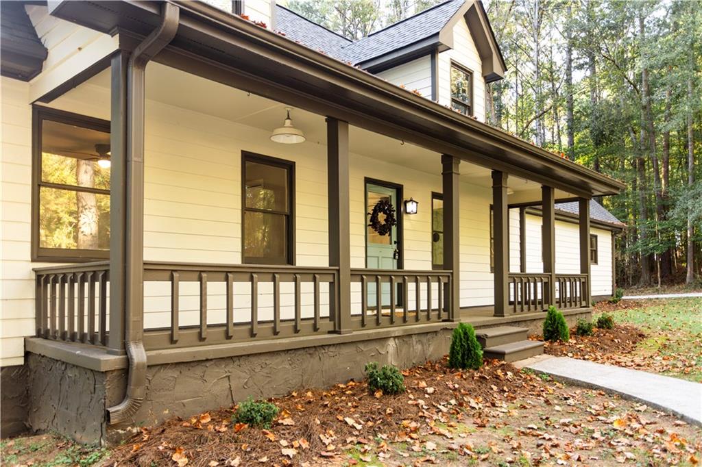 1149 Criswell Road Southeast Monroe, GA 30655 - Photo 3 of 60 a view of a house with a small yard and wooden floor and fence