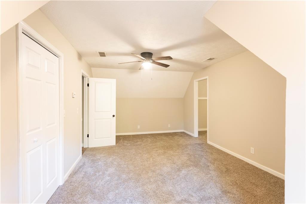 1149 Criswell Road Southeast Monroe, GA 30655 - Photo 32 of 60 an empty room with a ceiling fan and a window