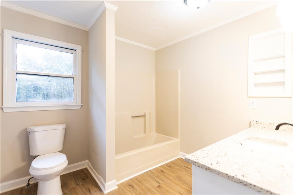 1149 Criswell Road Southeast Monroe, GA 30655 - Photo 35 of 60 a bathroom with a sink and a toilet