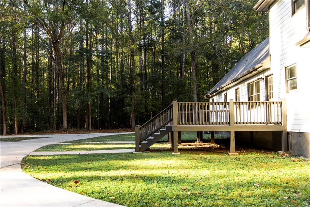 1149 Criswell Road Southeast Monroe, GA 30655 - Photo 40 of 60 a view of a house with a backyard