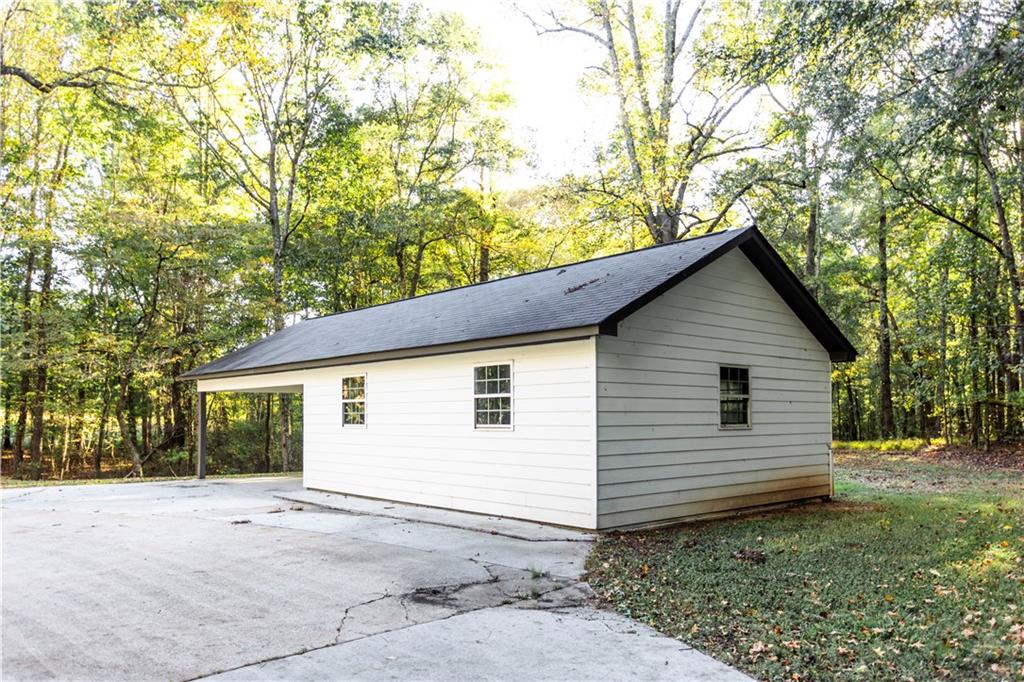 1149 Criswell Road Southeast Monroe, GA 30655 - Photo 42 of 60 a view of a house with a yard