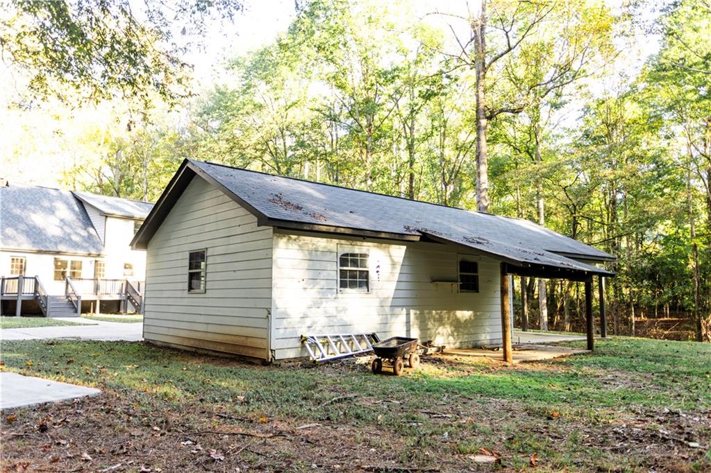 1149 Criswell Road Southeast Monroe, GA 30655 - Photo 43 of 60 a front view of a house with garden
