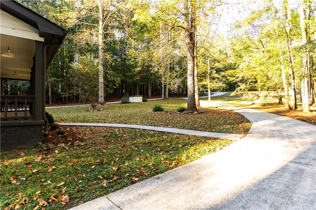 1149 Criswell Road Southeast Monroe, GA 30655 - Photo 48 of 60 a view of a backyard with large trees