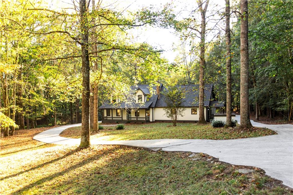 1149 Criswell Road Southeast Monroe, GA 30655 - Photo 49 of 60 a view of a house with backyard and tree