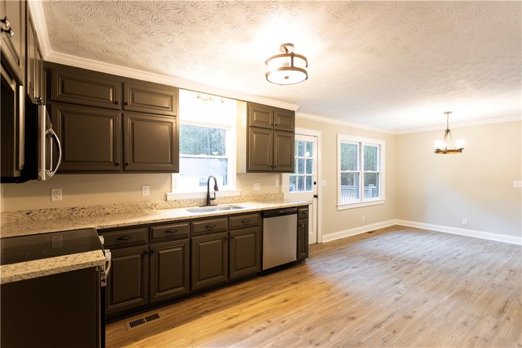 1149 Criswell Road Southeast Monroe, GA 30655 - Photo 9 of 60 a spacious bathroom with a double vanity sink and a mirror