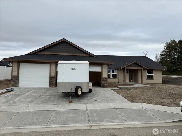 a view of a car in front of a house