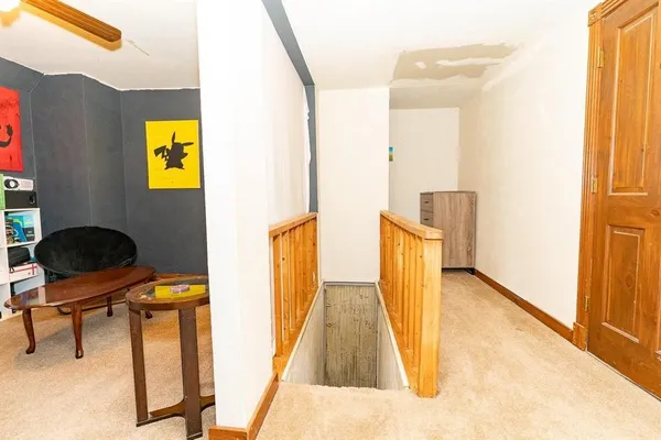 a view of a living room with windows