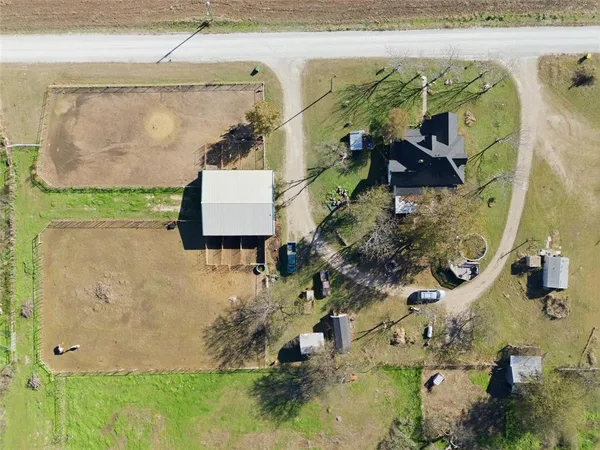 an aerial view of residential house with outdoor space