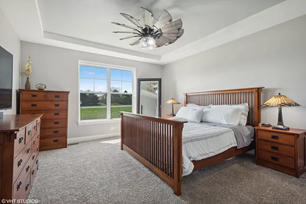 a bed room with a bed and a television