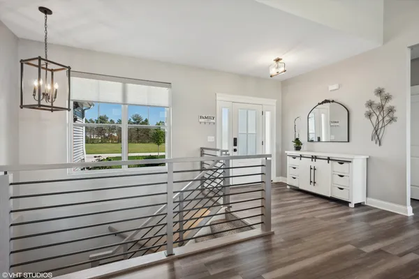 a view of a kitchen with furniture window and wooden floor