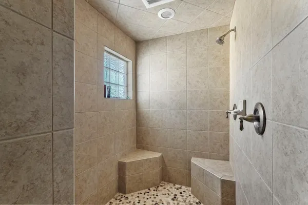 a bathroom with a double vanity sink and mirror