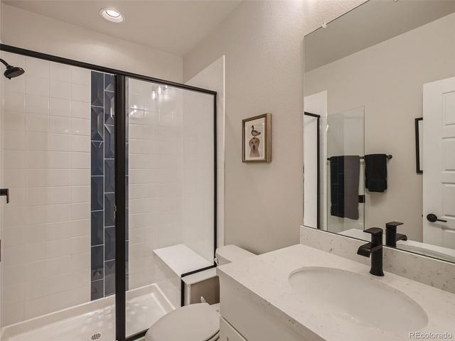 a bathroom with a sink and a large mirror