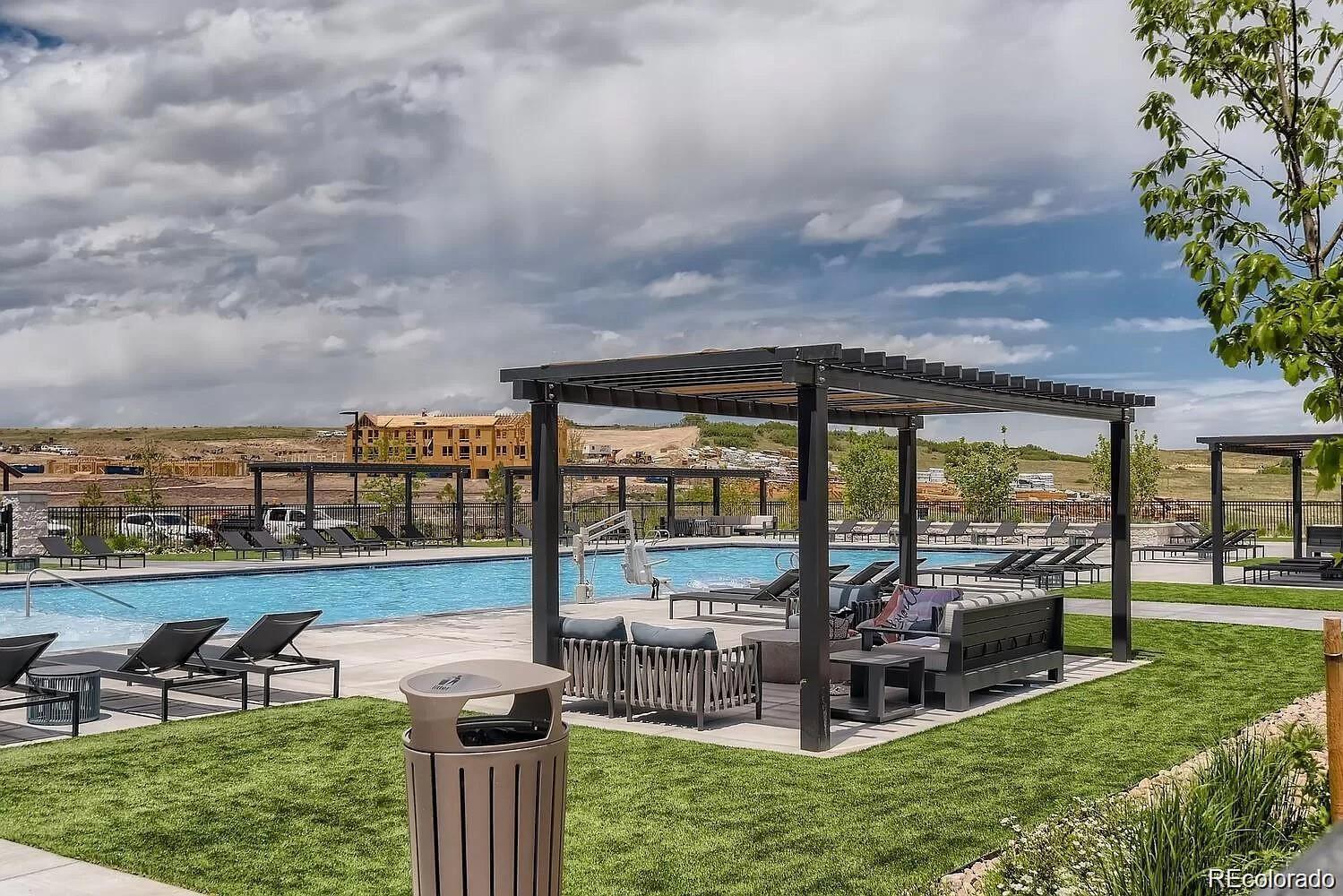 1602 Stablecross Drive Castle Pines, CO 80108 - Photo 27 of 28 a view of a chair and tables in the garden and yard