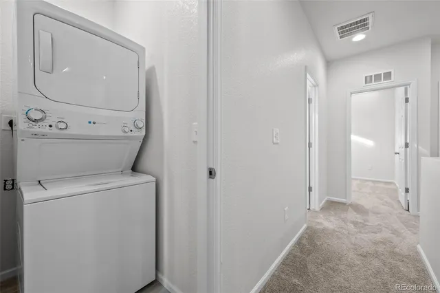 a view of bathroom with a washer and dryer