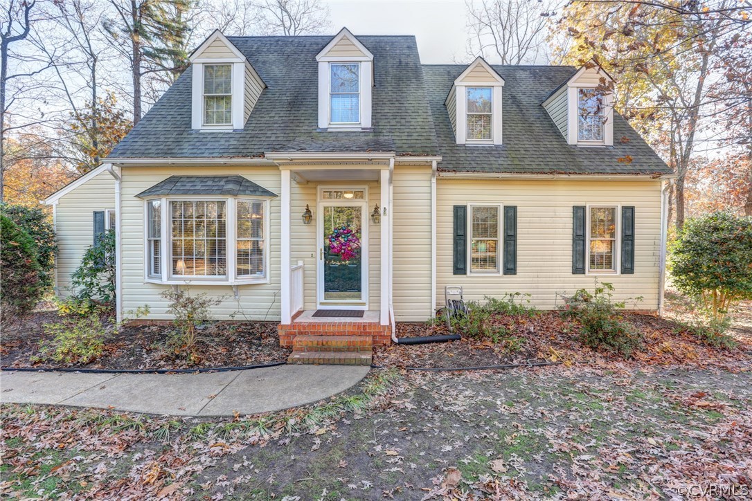 13601 Queensgate Road Midlothian, VA 23114 - Photo 1 of 39 a front view of a house with garden