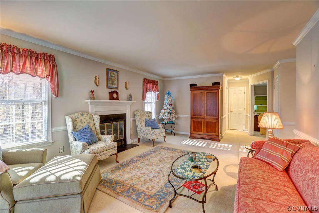 13601 Queensgate Road Midlothian, VA 23114 - Photo 15 of 39 a living room with furniture a fireplace and a large window