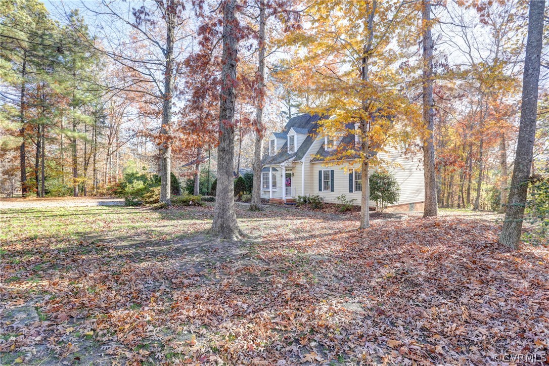 13601 Queensgate Road Midlothian, VA 23114 - Photo 2 of 39 a view of house with yard and trees