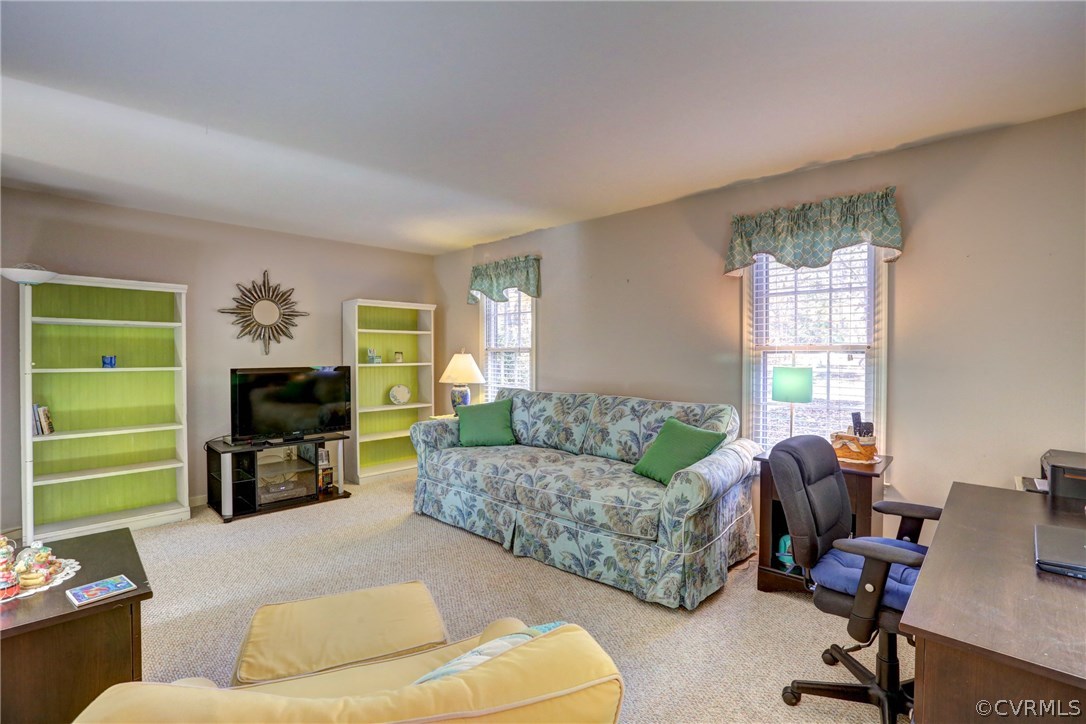 13601 Queensgate Road Midlothian, VA 23114 - Photo 23 of 39 a living room with furniture and a fireplace