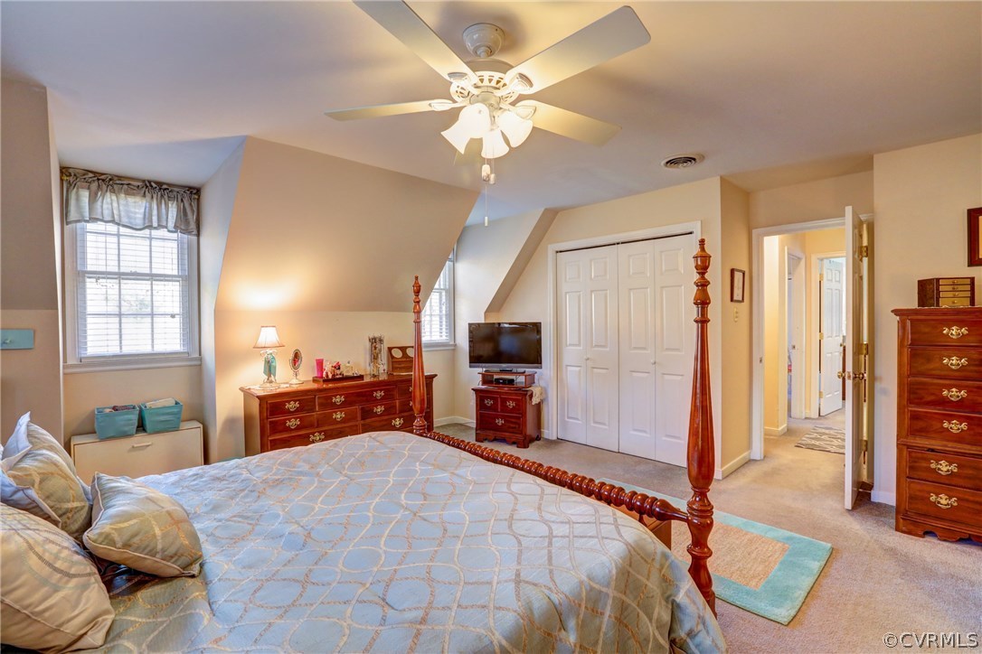 13601 Queensgate Road Midlothian, VA 23114 - Photo 31 of 39 a bedroom with a bed dresser and a large mirror
