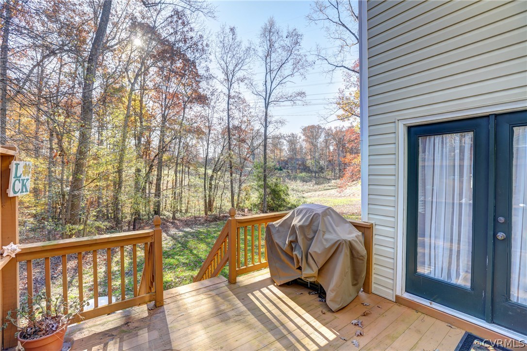 13601 Queensgate Road Midlothian, VA 23114 - Photo 34 of 39 a view of a balcony with couch and wooden fence