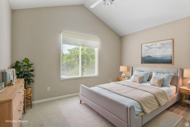 1417 Blacksmith Lane Draper, UT 84020 - Photo 36 of 57 Room featuring a vaulted ceiling, large window with blinds, and neutral wall tones