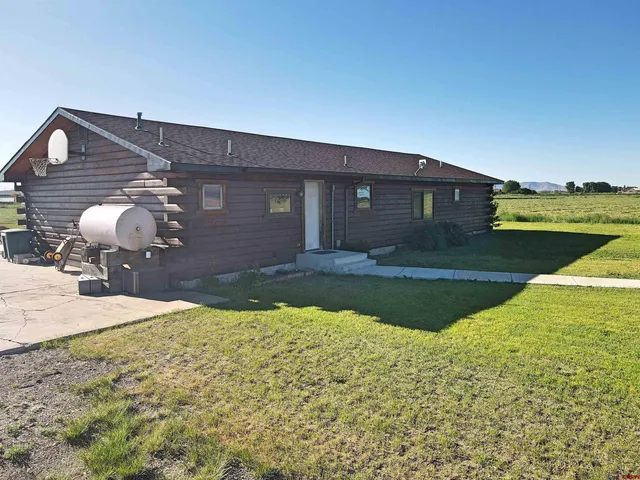 a front view of a house with yard