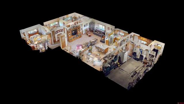 a bed sitting in a bedroom next to a lamp