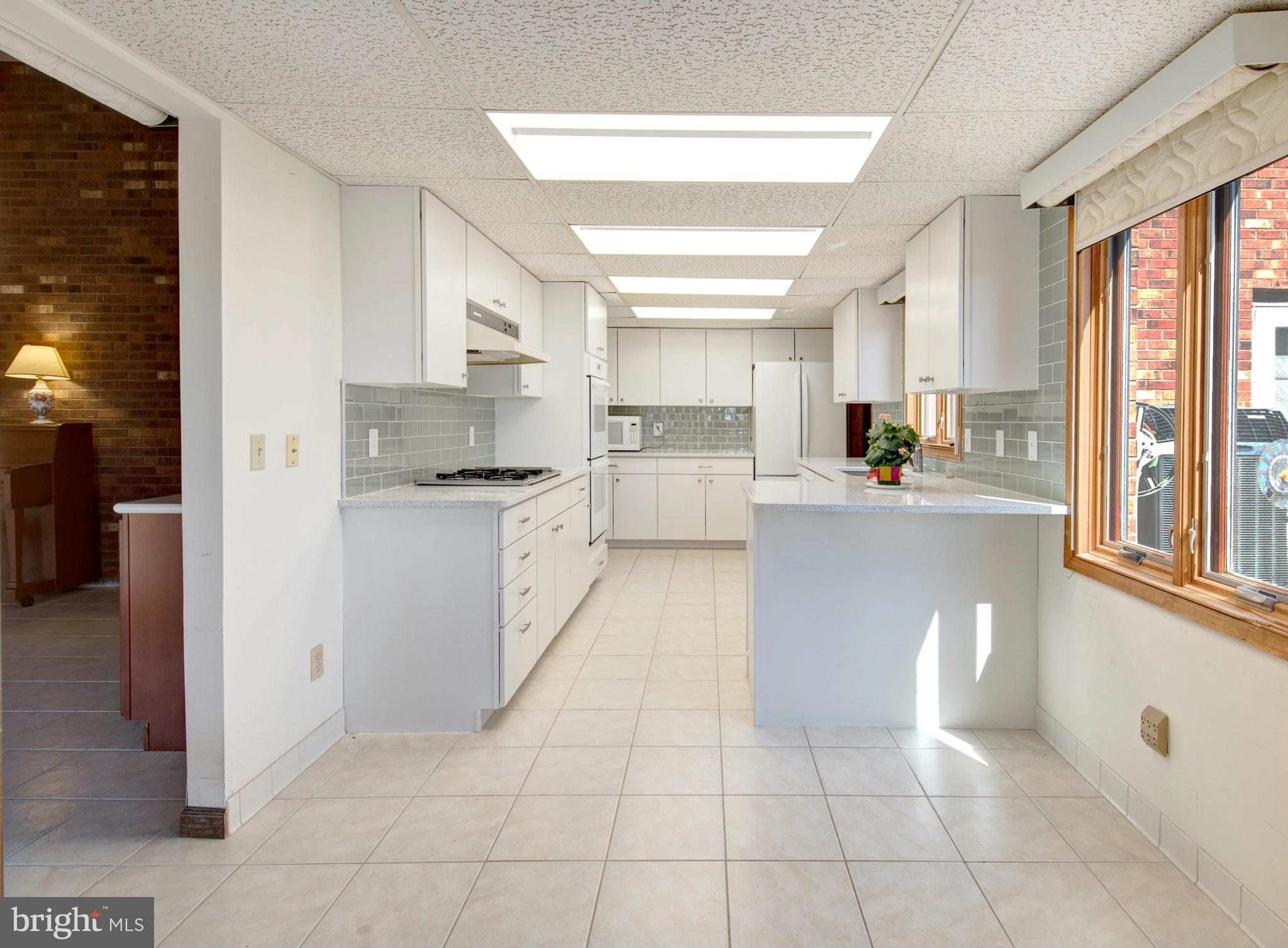229 Birch Run Road Chestertown, MD 21620 - Photo 11 of 22 a kitchen with cabinets and a window