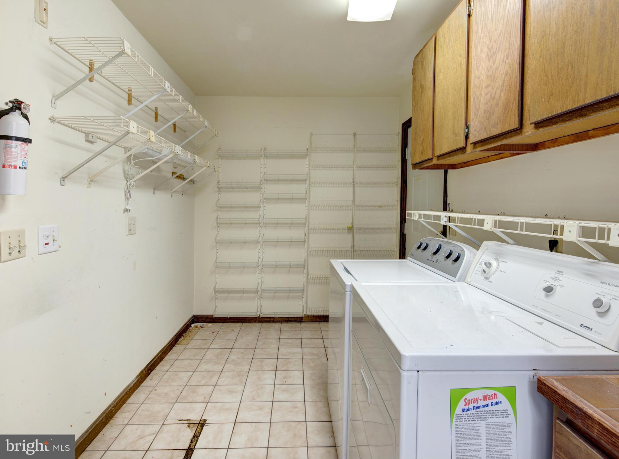 229 Birch Run Road Chestertown, MD 21620 - Photo 14 of 22 a utility room with cabinets washer and dryer