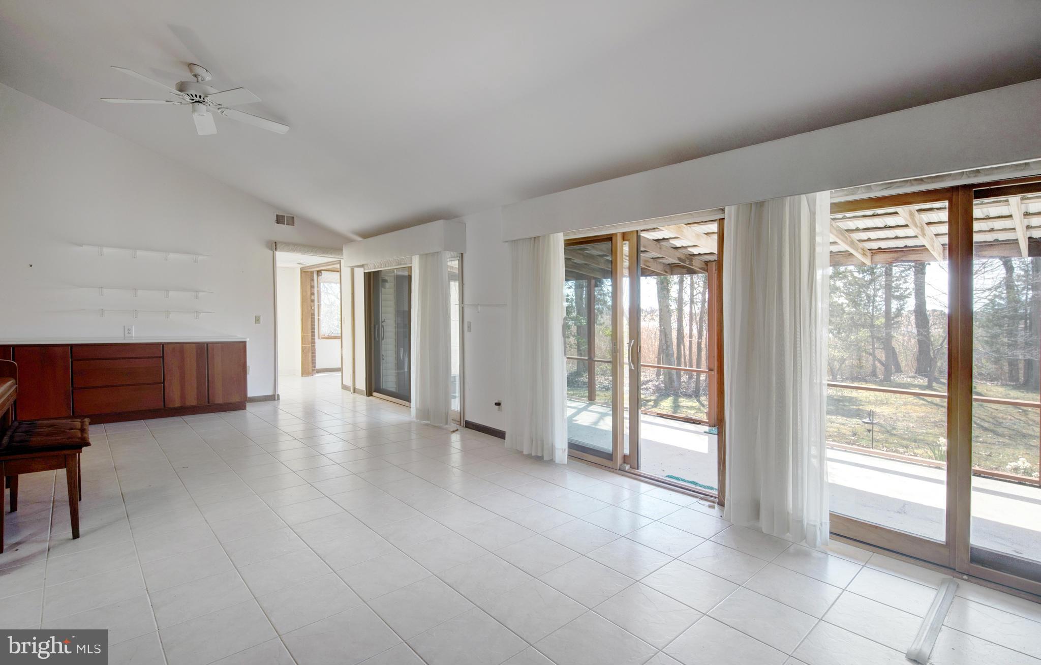 229 Birch Run Road Chestertown, MD 21620 - Photo 9 of 22 a view of an empty room with glass door