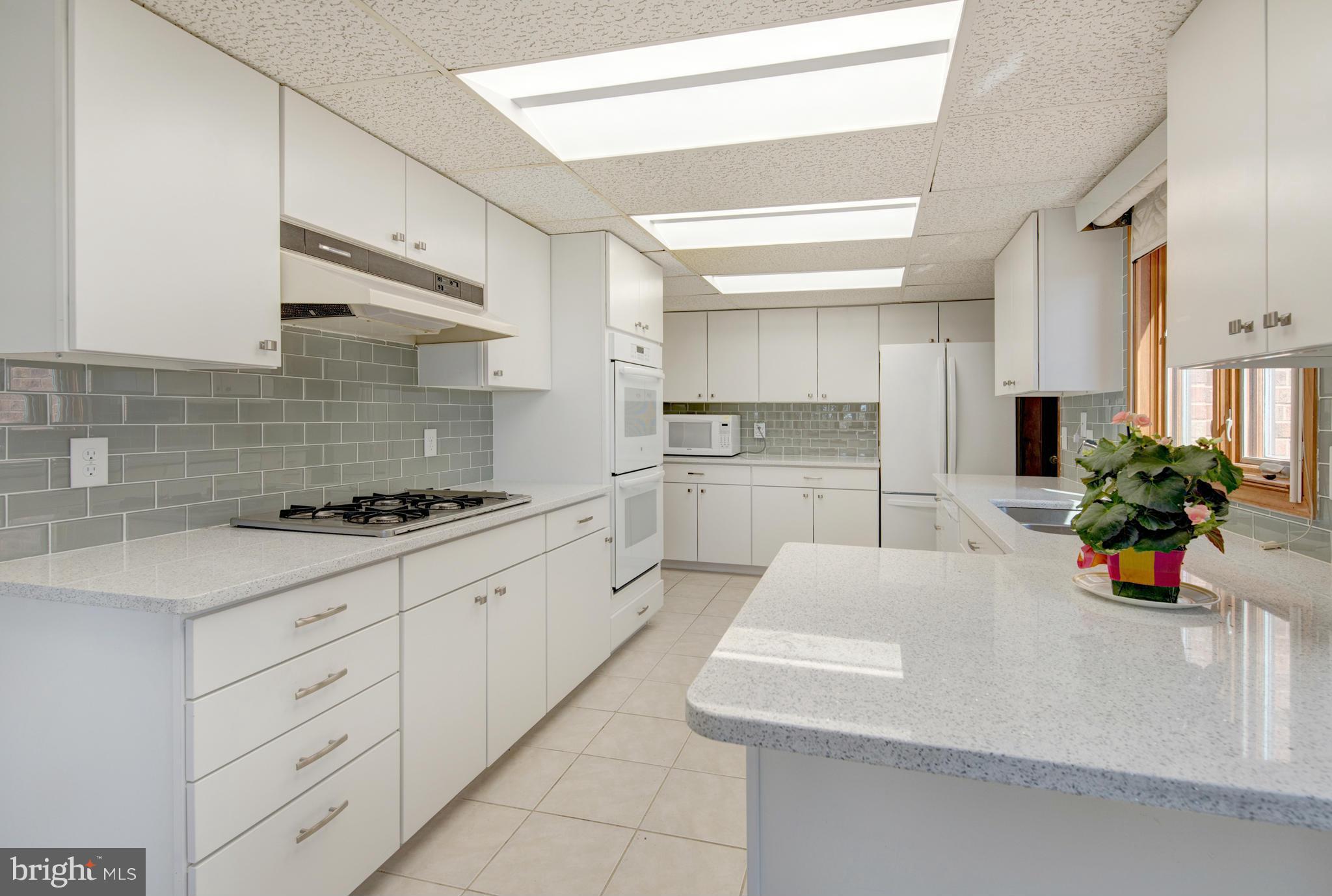 229 Birch Run Road Chestertown, MD 21620 - Photo 10 of 22 a kitchen with white cabinets and appliances