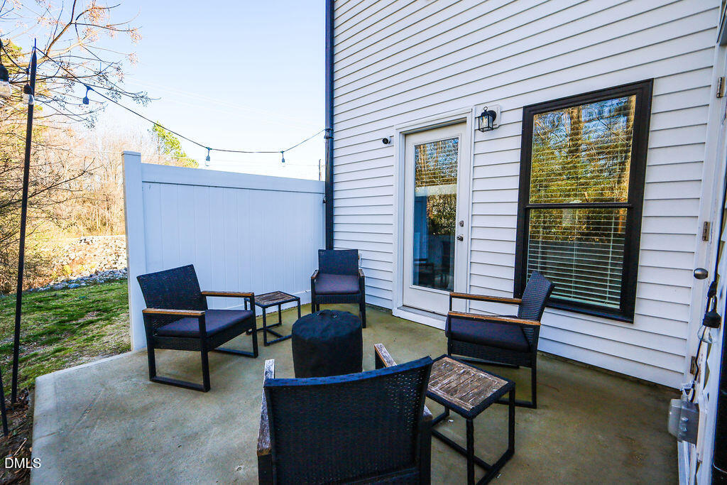 230 South Raleigh Street Angier, NC 27501 - Photo 37 of 38 a backyard of a house with outdoor seating