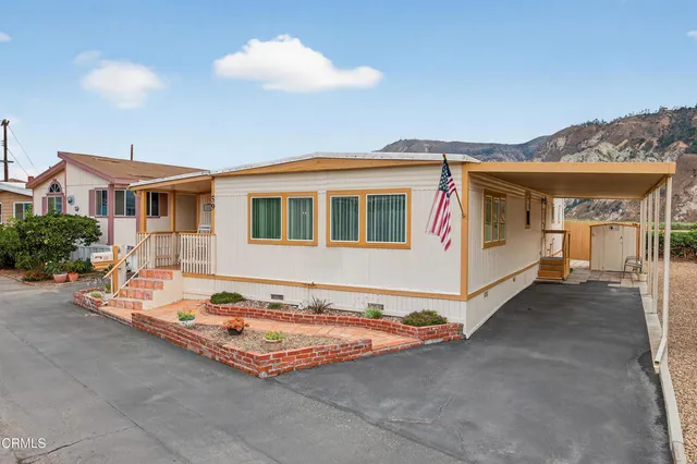 a front view of a house with yard