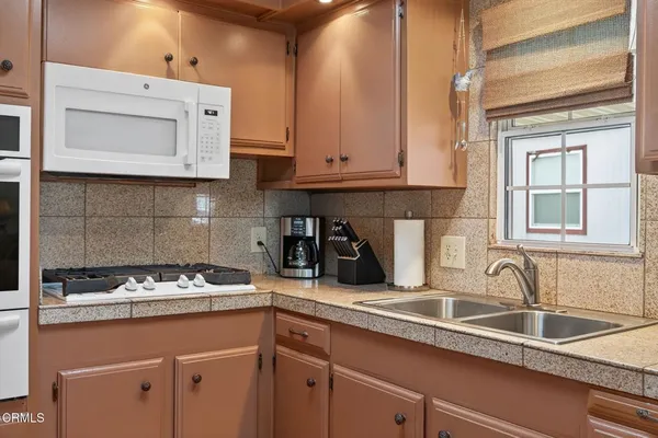 a kitchen with a sink and cabinets