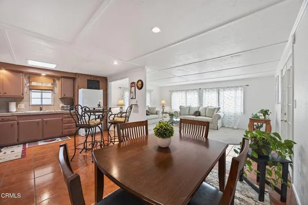 a view of a dining room with furniture window and outside view