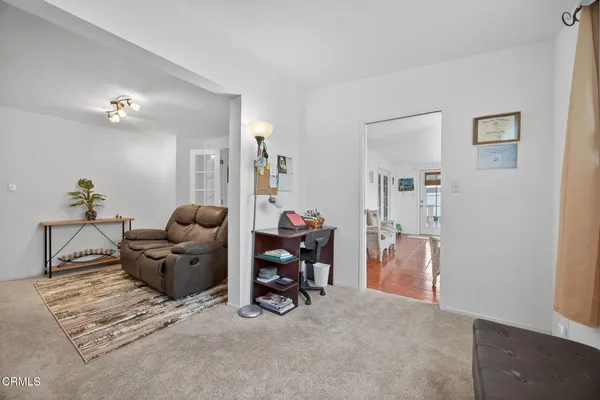 a living room with furniture and a table