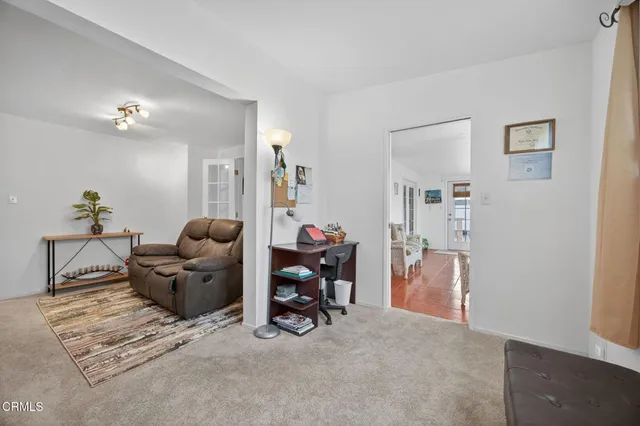 a living room with furniture and a table