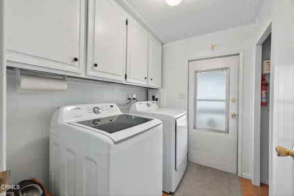 a kitchen with a sink cabinets and utility