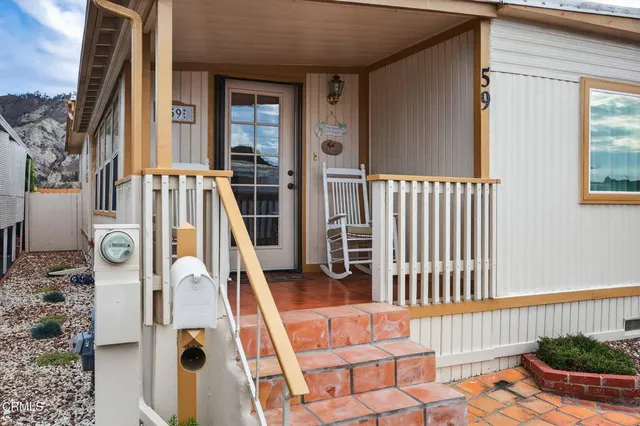 a front view of a house with stairs