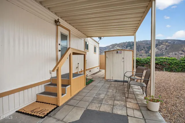 a view of entryway with workspace and stairs