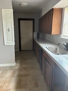 a view of a kitchen with a sink and dishwasher