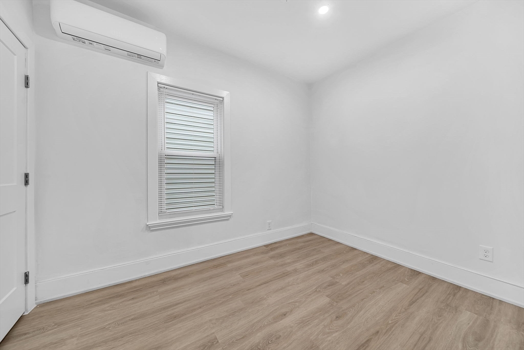 92 Willow Street, Unit 3 Cambridge, MA 02141 - Photo 14 of 17 wooden floor in an empty room