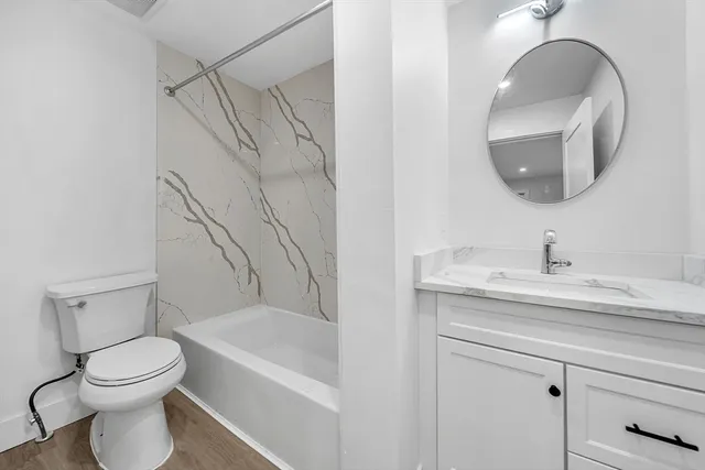 a bathroom with a toilet sink and bathtub